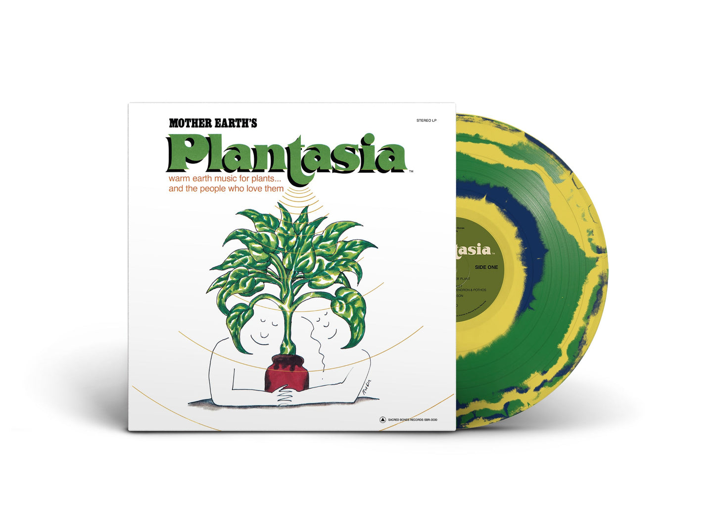 Mother Earthʼs Plantasia vinyl record with green and yellow marbled design and illustrated cover art of two figures hugging a plant