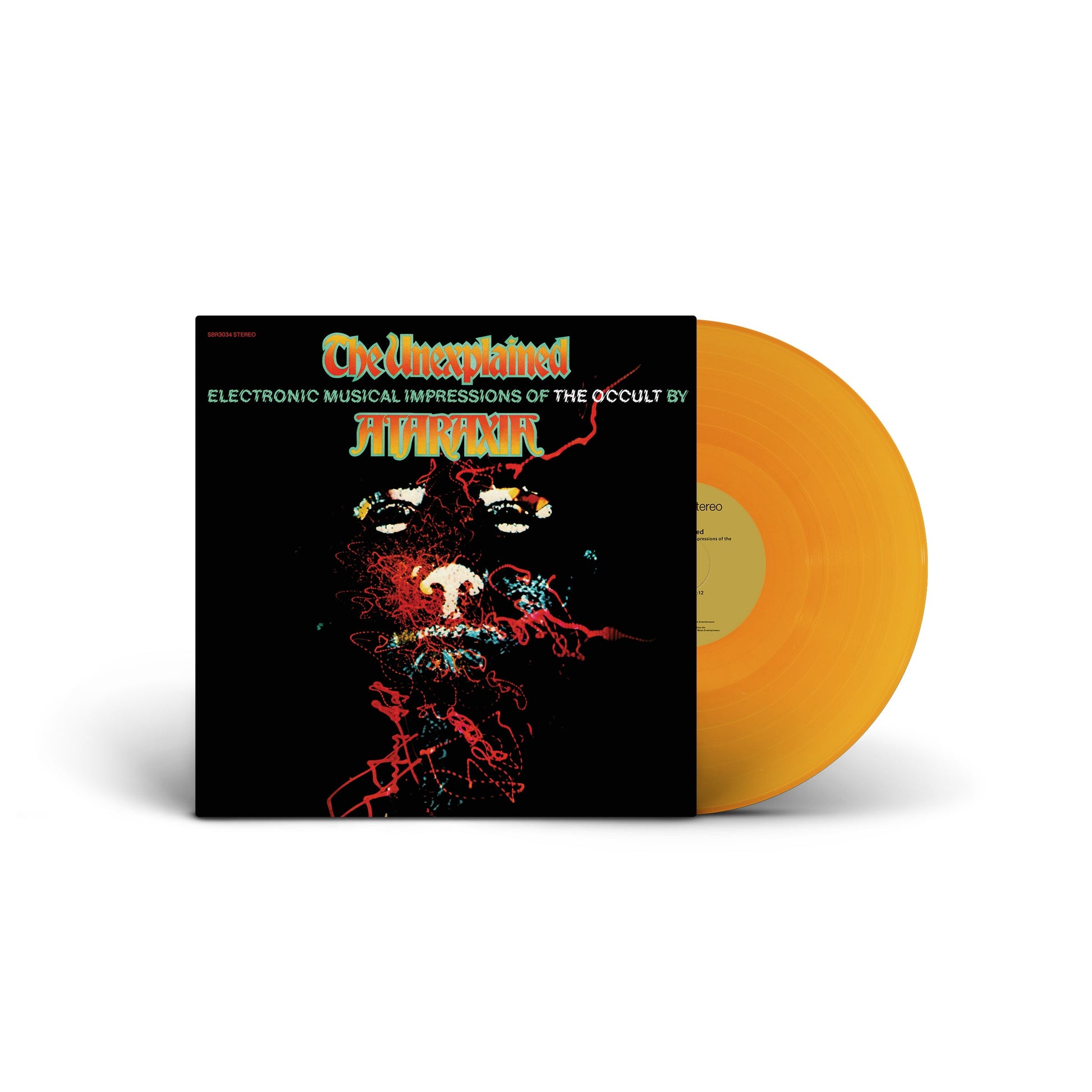 The Unexplained vinyl record with orange translucent disc and dark cover featuring abstract face design and text.